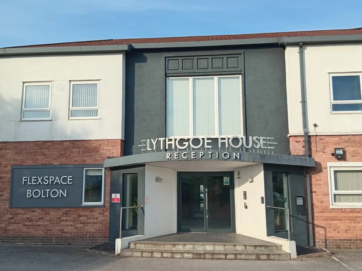 The reception entrance of Lythgoe House on Manchester Road, Bolton, signed Flexspace Bolton — home to Joint Venture Physiotherapy in Unit 28